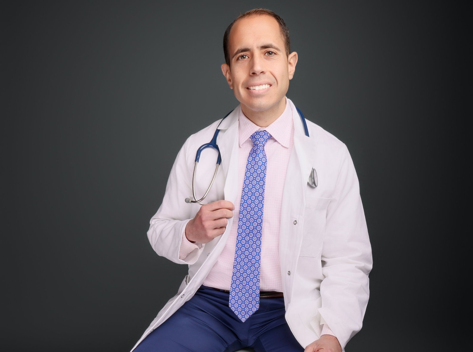 Dr. Ahmad Ammous in clinical attire